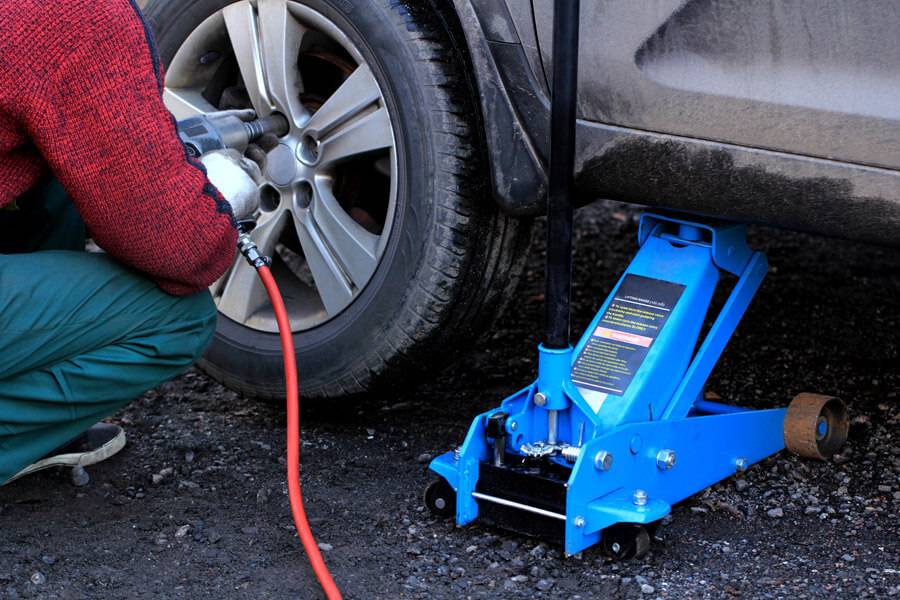 car jack and tyre being changed