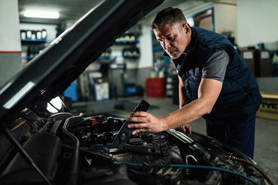 mechanic working on engine