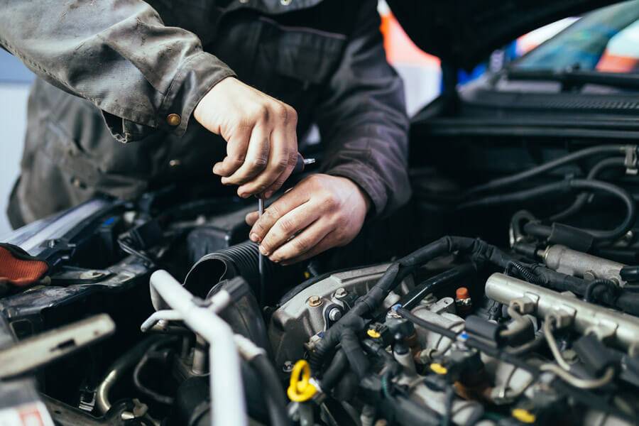 mechanic working on engine