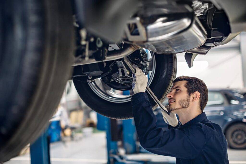 Mechanic completing car service